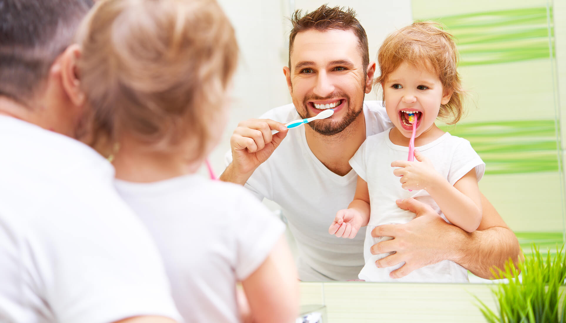 Father and Child brushing teeth